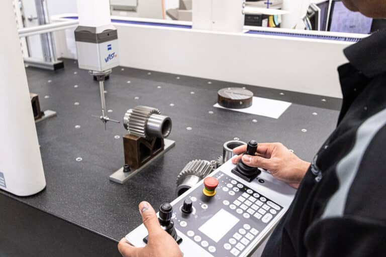 MASPRO engineer using a coordinate measuring machine to inspect a precision-engineered mining component