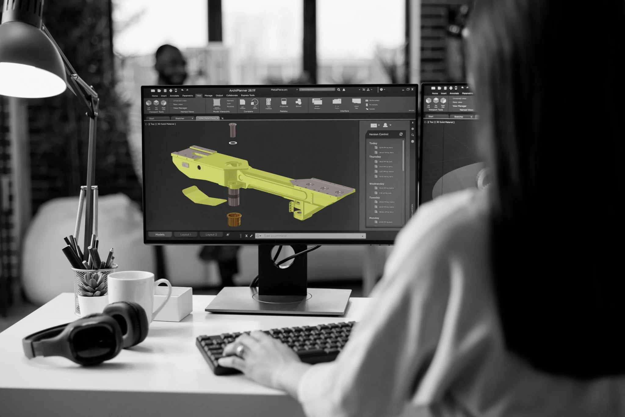 CAD software showing isometric 3D model of yellow cradle assembly component.