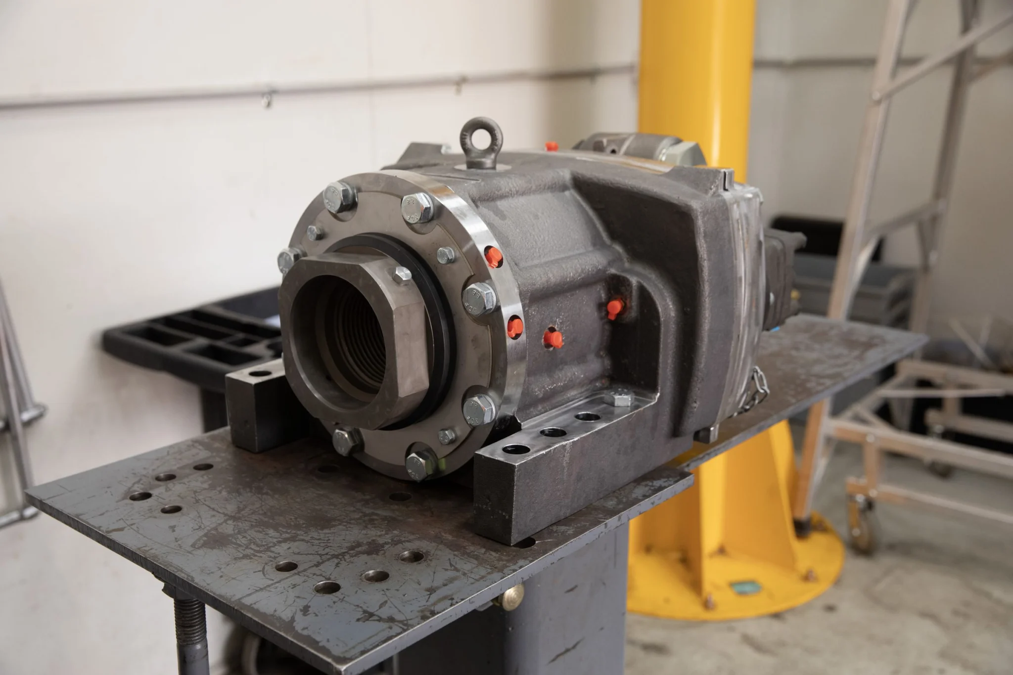Rotation head component mounted on test fixture in workshop.